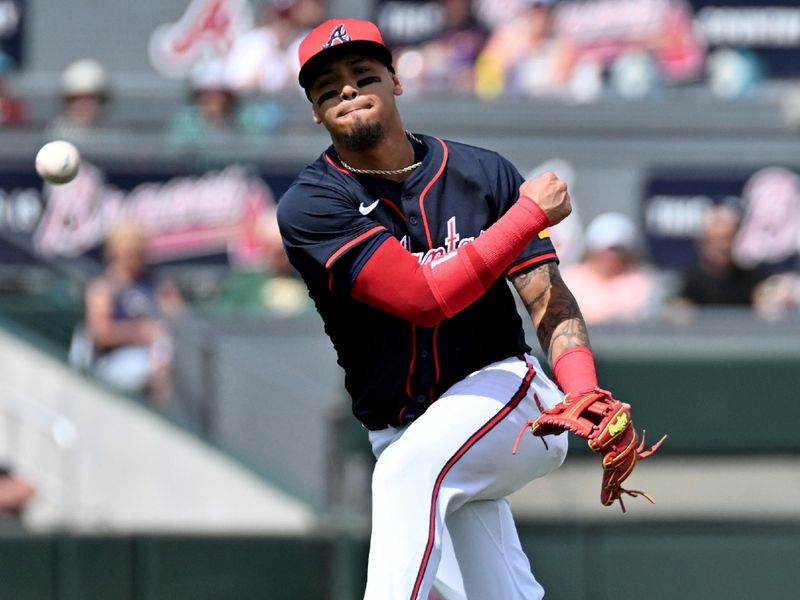 Mar 4, 2025; North Port, Florida, USA; Atlanta Braves shortstop Orlando Arcia (11) throws to first base  in the first inning against the Minnesota Twins during spring training at CoolToday Park. Mandatory Credit: Jonathan Dyer-Imagn Images