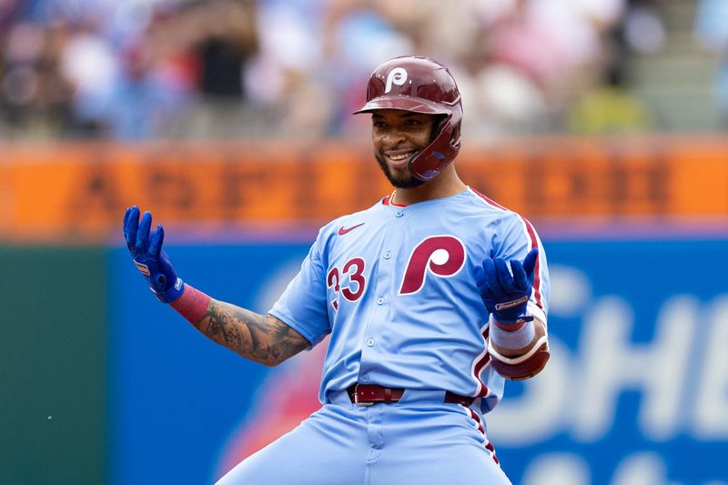 May 23, 2024; Philadelphia, Pennsylvania, USA; Philadelphia Phillies shortstop Edmundo Sosa (33) reacts after hitting a double during the fourth inning against the Texas Rangers at Citizens Bank Park. Mandatory Credit: Bill Streicher-USA TODAY Sports
