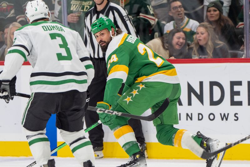 Nov 16, 2024; Saint Paul, Minnesota, USA; Minnesota Wild defenseman Zach Bogosian (24) and Dallas Stars defenseman Mathew Dumba (3) chat after a hard hit in the first period at Xcel Energy Center. Mandatory Credit: Matt Blewett-Imagn Images