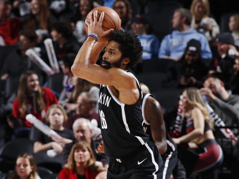 PORTLAND, OR - JANUARY 17: Spencer Dinwiddie #26 of the Brooklyn Nets looks to pass the ball during the game against the Portland Trail Blazers on January 17, 2024 at the Moda Center Arena in Portland, Oregon. NOTE TO USER: User expressly acknowledges and agrees that, by downloading and or using this photograph, user is consenting to the terms and conditions of the Getty Images License Agreement. Mandatory Copyright Notice: Copyright 2024 NBAE (Photo by Cameron Browne/NBAE via Getty Images)