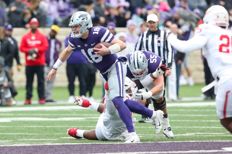 Oct 28, 2023; Manhattan, Kansas, USA; Kansas State Wildcats quarterback Will Howard (18) attempts to evade Houston Cougars defensive lineman Chidozie Nwankwo (10) during the first quarter at Bill Snyder Family Football Stadium. Mandatory Credit: Scott Sewell-USA TODAY Sports