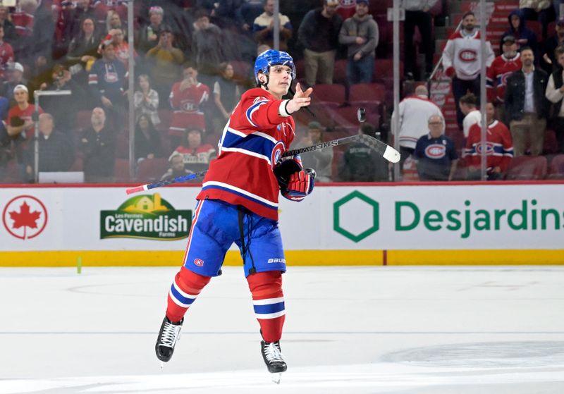 Apr 9, 2024; Montreal, Quebec, CAN; Montreal Canadiens forward Juraj Slafkovsky (20) throws a foam puck into the crowd after the win against the Philadelphia Flyers at the Bell Centre. Mandatory Credit: Eric Bolte-USA TODAY Sports