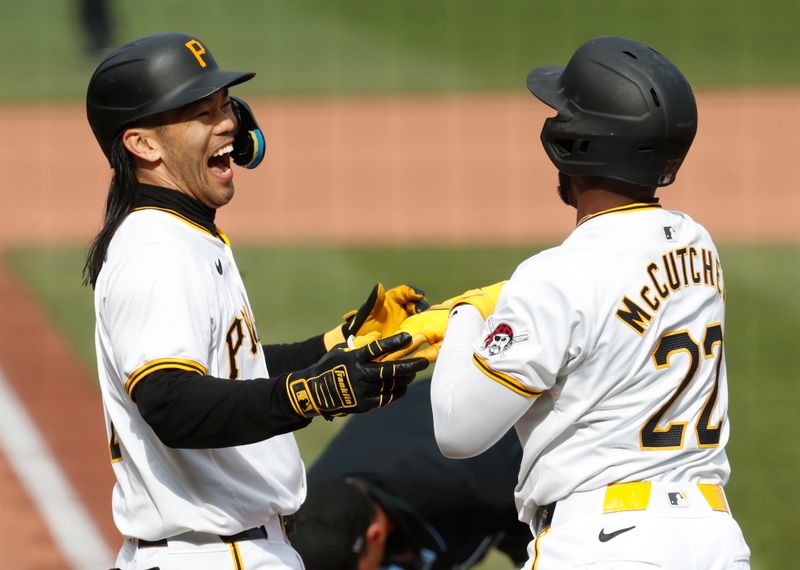 May 11, 2024; Pittsburgh, Pennsylvania, USA;  Pittsburgh Pirates first baseman Connor Joe (lef) celebrates his three run home run with designated hitter Andrew McCutchen (22) against the Chicago Cubs during the third inning at PNC Park. Mandatory Credit: Charles LeClaire-USA TODAY Sports