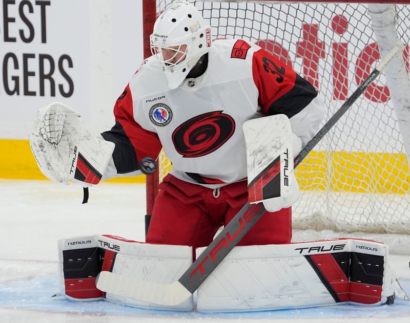 Nov 9, 2025; Toronto, Ontario, CAN; Carolina Hurricanes goaltender Brandon Bussi (32) makes a save during warm up before a game against the Toronto Maple Leafs at Scotiabank Arena. Mandatory Credit: John E. Sokolowski-Imagn Images
