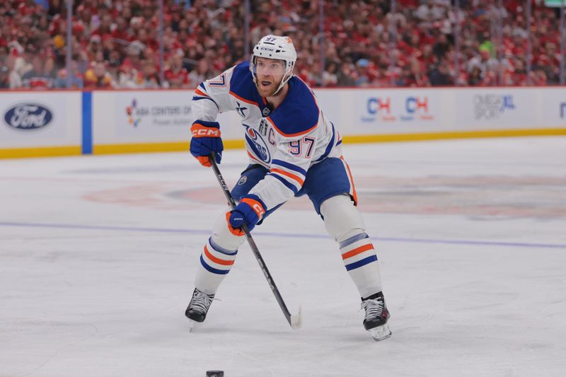 Jun 9, 2025; Sunrise, Florida, USA; Edmonton Oilers center Connor McDavid (97) controls the puck during the first period against the Florida Panthers in game three of the 2025 Stanley Cup Final at Amerant Bank Arena. Mandatory Credit: Sam Navarro-Imagn Images