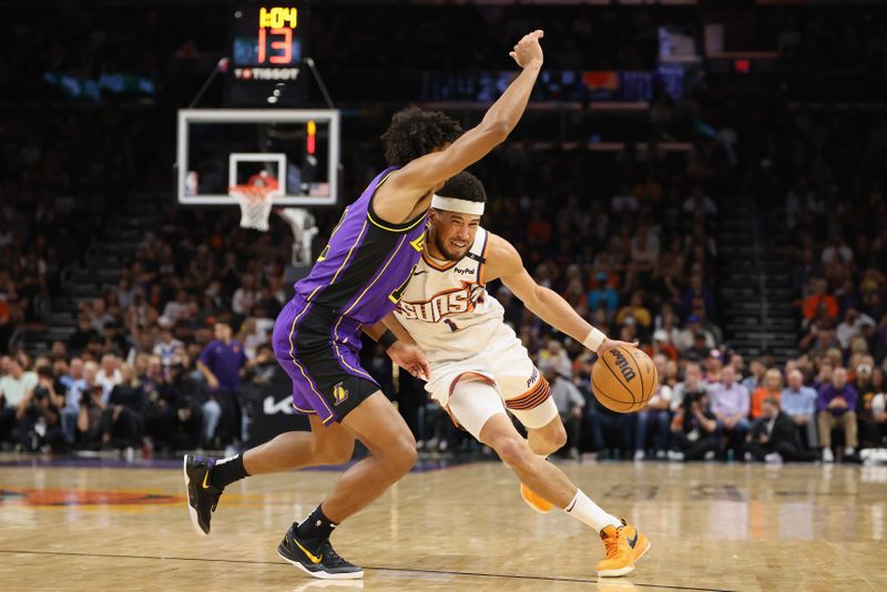 PHOENIX, ARIZONA - OCTOBER 28: Devin Booker #1 of the Phoenix Suns drives the ball against Max Christie #12 of the Los Angeles Lakers during the first half of the NBA game at Footprint Center on October 28, 2024 in Phoenix, Arizona.  NOTE TO USER: User expressly acknowledges and agrees that, by downloading and/or using this photograph, user is consenting to the terms and conditions of the Getty Images License Agreement. (Photo by Christian Petersen/Getty Images)