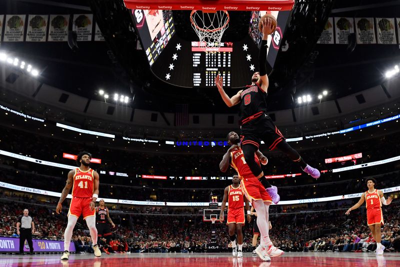 CHICAGO, ILLINOIS - APRIL 04: Zach LaVine #8 of the Chicago Bulls shoots against the Atlanta Hawks at United Center on April 04, 2023 in Chicago, Illinois. NOTE TO USER: User expressly acknowledges and agrees that, by downloading and or using this photograph, User is consenting to the terms and conditions of the Getty Images License Agreement.  (Photo by Quinn Harris/Getty Images)