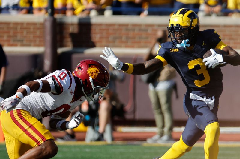 Sep 21, 2024; Ann Arbor, Michigan, USA;  Michigan Wolverines wide receiver Fredrick Moore (3) runs the ball in the first half against the USC Trojans at Michigan Stadium. Mandatory Credit: Rick Osentoski-Imagn Images