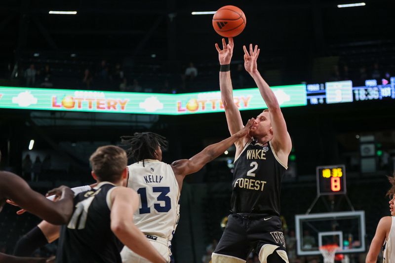 Feb 6, 2024; Atlanta, Georgia, USA; Wake Forest Demon Deacons guard Cameron Hildreth (2) shoots over Georgia Tech Yellow Jackets guard Miles Kelly (13) in the first half at McCamish Pavilion. Mandatory Credit: Brett Davis-USA TODAY Sports