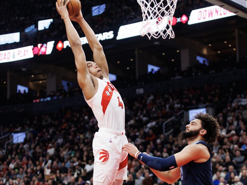 TORONTO, CANADA - JANUARY 22: Scottie Barnes #4 of the Toronto Raptors dunks against David Roddy #21 of the Memphis Grizzlies in the first half at Scotiabank Arena on January 22, 2024 in Toronto, Canada. NOTE TO USER: User expressly acknowledges and agrees that, by downloading and or using this photograph, User is consenting to the terms and conditions of the Getty Images License Agreement. (Photo by Cole Burston/Getty Images)