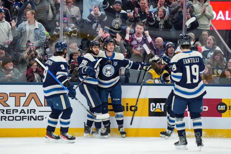 Jan 4, 2026; Columbus, Ohio, USA;  Columbus Blue Jackets left wing Mason Marchment (17) celebrates with teammates after scoring a goal against the Pittsburgh Penguins in the first period at Nationwide Arena. Mandatory Credit: Aaron Doster-Imagn Images