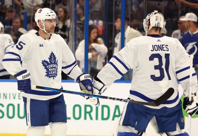 Apr 17, 2024; Tampa, Florida, USA; Toronto Maple Leafs defenseman Mark Giordano (55) and goaltender Martin Jones (31) at the end of the first period against the Tampa Bay Lightning at Amalie Arena. Mandatory Credit: Kim Klement Neitzel-USA TODAY Sports