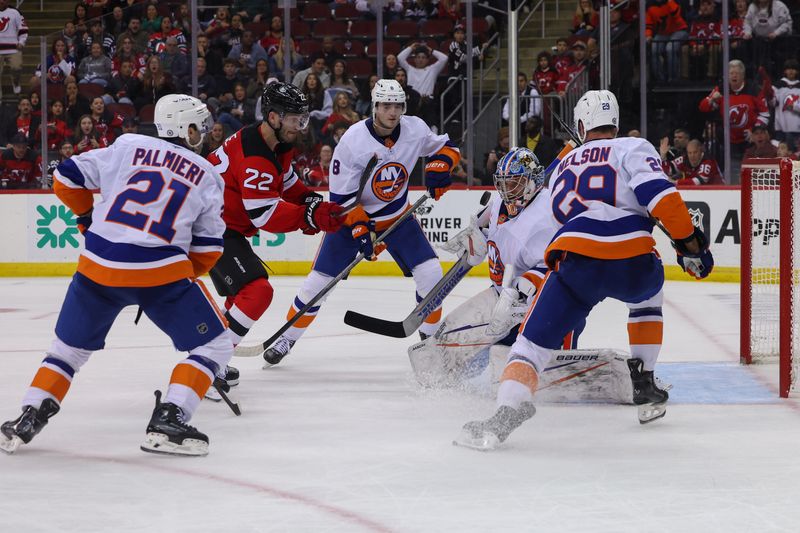 Oct 25, 2024; Newark, New Jersey, USA; New York Islanders goaltender Ilya Sorokin (30) makes a save against the New Jersey Devils during overtime at Prudential Center. Mandatory Credit: Ed Mulholland-Imagn Images