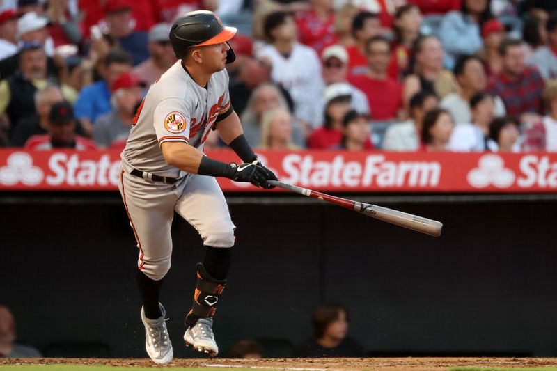 Sep 6, 2023; Anaheim, California, USA;  Baltimore Orioles second baseman Ramon Urias (29) hits an RBI single during the second inning against the Los Angeles Angels at Angel Stadium. Mandatory Credit: Kiyoshi Mio-USA TODAY Sports