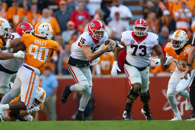 Nov 18, 2023; Knoxville, Tennessee, USA; Georgia Bulldogs quarterback Carson Beck (15) runs the ball against the Tennessee Volunteers during the first half at Neyland Stadium. Mandatory Credit: Randy Sartin-USA TODAY Sports