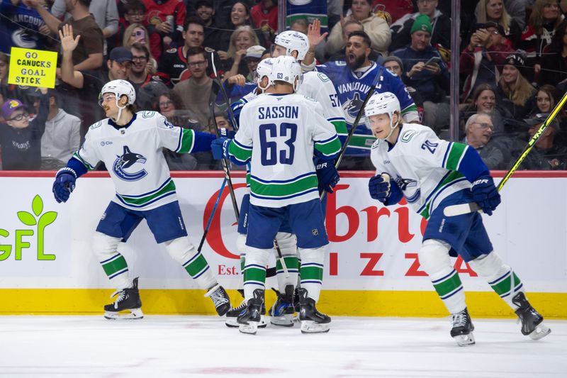 Nov 23, 2024; Ottawa, Ontario, CAN; Vancouver Canucks center Teddy Blueger (53) celebrates a goal scored in the second period against the Ottawa Senators at the Canadian Tire Centre. Mandatory Credit: Marc DesRosiers-Imagn Images