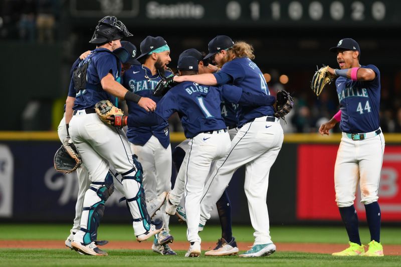 Jun 11, 2024; Seattle, Washington, USA; The Seattle Mariners celebrate defeating the Chicago White Sox at T-Mobile Park. Mandatory Credit: Steven Bisig-USA TODAY Sports