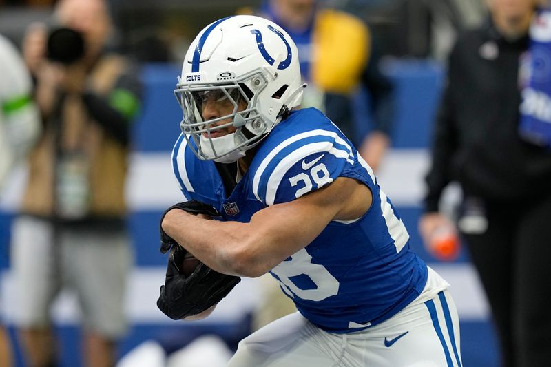 Indianapolis Colts running back Jonathan Taylor warms up before an NFL football game against the Tennessee Titans, Sunday, Oct. 8, 2023, in Indianapolis. (AP Photo/Darron Cummings)