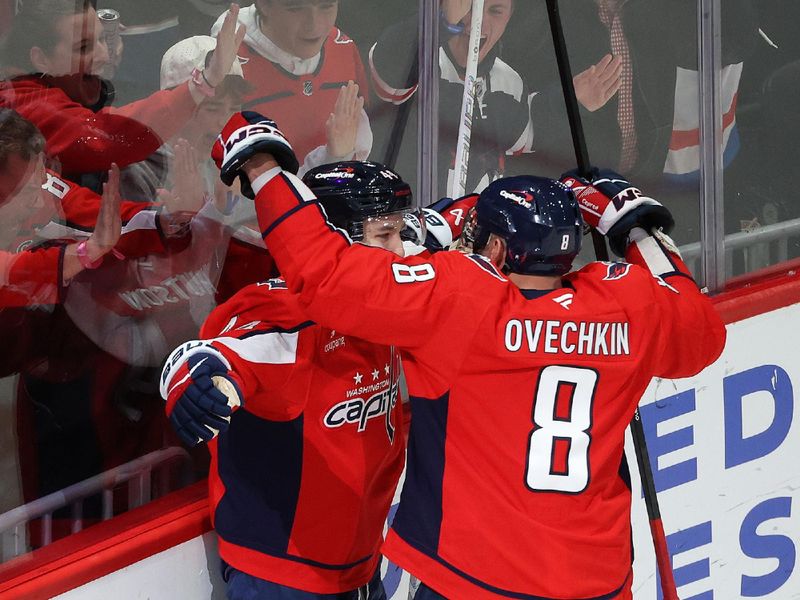 Mar 18, 2026; Washington, District of Columbia, USA; Washington Capitals defenseman Cole Hutson (44) celebrates with Washington Capitals left wing Alex Ovechkin (8) after scoring his first NHL goal during the third period against the Ottawa Senators at Capital One Arena. Mandatory Credit: Daniel Kucin Jr.-Imagn Images