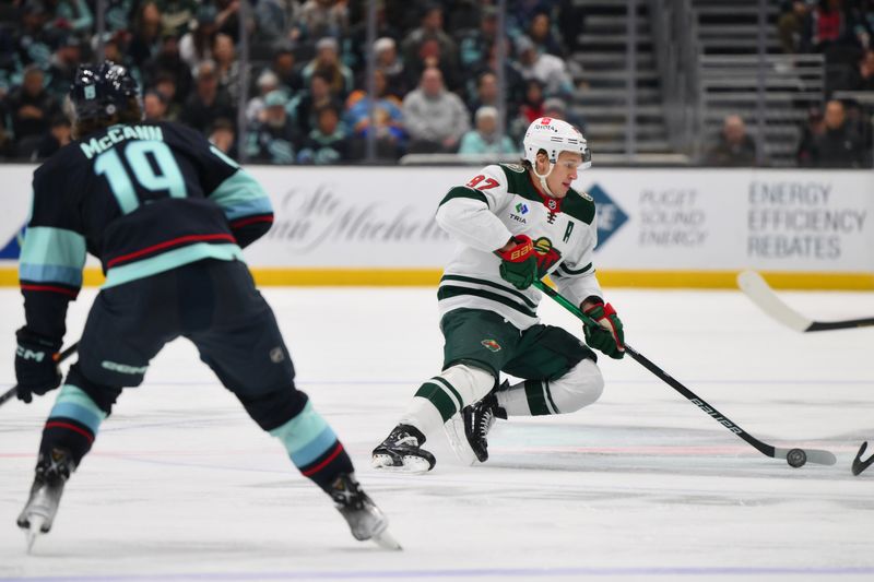 Dec 10, 2023; Seattle, Washington, USA; Minnesota Wild left wing Kirill Kaprizov (97) plays the puck during the third period against the Seattle Kraken at Climate Pledge Arena. Mandatory Credit: Steven Bisig-USA TODAY Sports