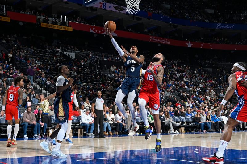 PHILADELPHIA, PA - JANUARY 10: Dejounte Murray #5 of the New Orleans Pelicans drives to the basket during the game against the Philadelphia 76ers on January 10, 2025 at the Wells Fargo Center in Philadelphia, Pennsylvania NOTE TO USER: User expressly acknowledges and agrees that, by downloading and/or using this Photograph, user is consenting to the terms and conditions of the Getty Images License Agreement. Mandatory Copyright Notice: Copyright 2025 NBAE (Photo by David Dow/NBAE via Getty Images)