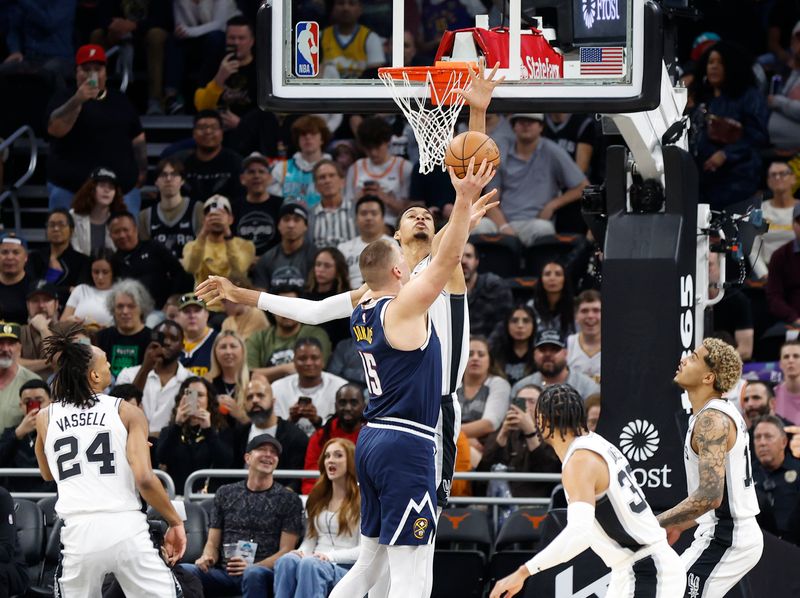 AUSTIN, TX - MARCH 15: Victor Wembanyama #1 of the San Antonio Spurs blocks the shot of Nikola Jokic #15 of the Denver Nuggets in the first half at Moody Center on March 15, 2024 in Austin, Texas. NOTE TO USER: User expressly acknowledges and agrees that, by downloading and or using this photograph, User is consenting to terms and conditions of the Getty Images License Agreement. (Photo by Ronald Cortes/Getty Images)