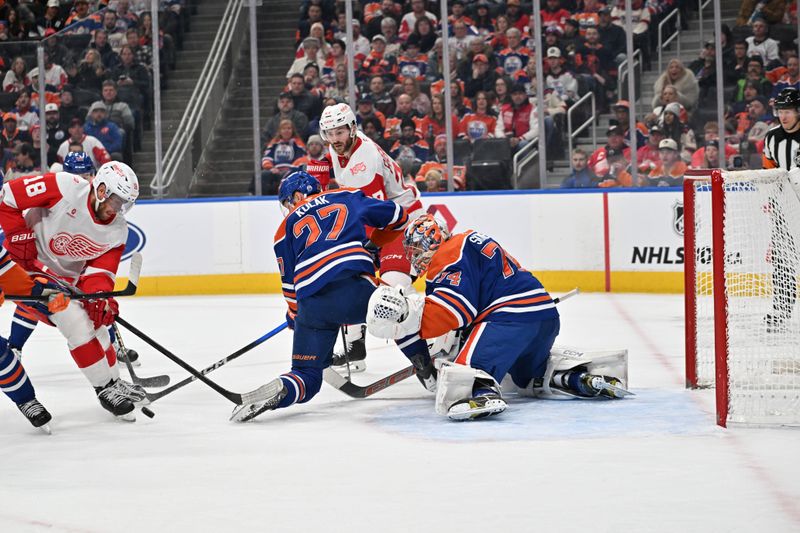 Dec 11, 2025; Edmonton, Alberta, CAN; Detroit Red Wings center Andrew Copp (18) tries to get the puck past Edmonton Oilers defenseman Brett Kulak (27) as he gets in front of Edmonton Oilers goalie Stuart Skinner (74) during the second period at Rogers Place. Mandatory Credit: Walter Tychnowicz-Imagn Images