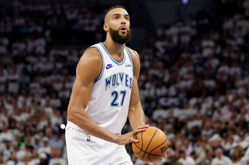 MINNEAPOLIS, MINNESOTA - MAY 22: Rudy Gobert #27 of the Minnesota Timberwolves shoots a free throw during the second quarter against the Dallas Mavericks in Game One of the Western Conference Finals at Target Center on May 22, 2024 in Minneapolis, Minnesota. NOTE TO USER: User expressly acknowledges and agrees that, by downloading and or using this photograph, User is consenting to the terms and conditions of the Getty Images License Agreement. (Photo by David Berding/Getty Images)