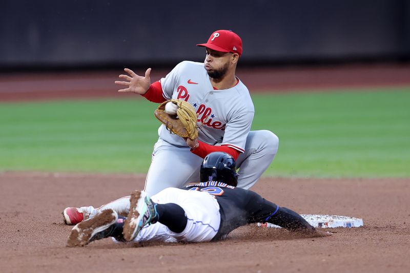 Sep 30, 2023; New York City, New York, USA; New York Mets shortstop Francisco Lindor (12) is caught stealing second base by Philadelphia Phillies shortstop Edmundo Sosa (33) during the eighth inning at Citi Field. Mandatory Credit: Brad Penner-USA TODAY Sports