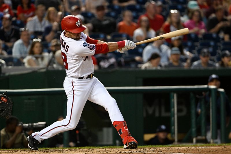 Apr 4, 2023; Washington, District of Columbia, USA; Washington Nationals right fielder Lane Thomas (28) hits a two RBI double against the Tampa Bay Rays during the second inning at Nationals Park. Mandatory Credit: Brad Mills-USA TODAY Sports