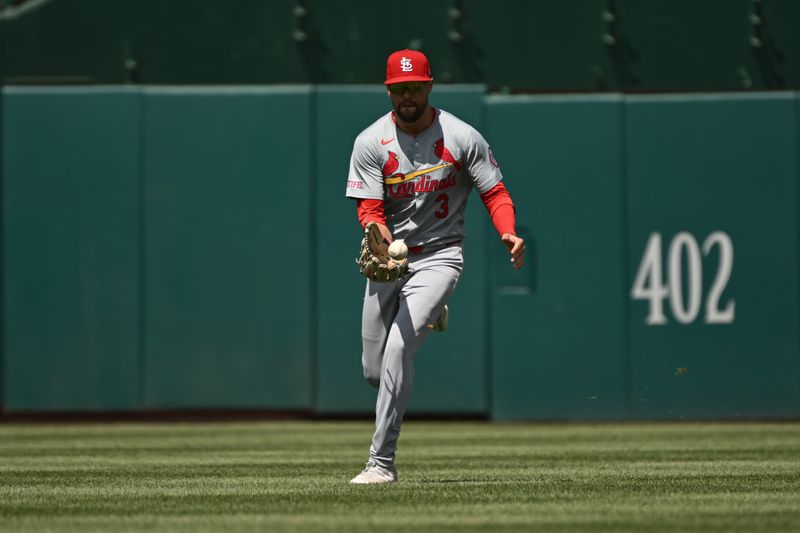 Jul 7, 2024; Washington, District of Columbia, USA; St. Louis Cardinals right fielder Dylan Carlson (3) fields the ball in the outfield against the Washington Nationals during the fifth inning at Nationals Park. Mandatory Credit: Rafael Suanes-USA TODAY Sports