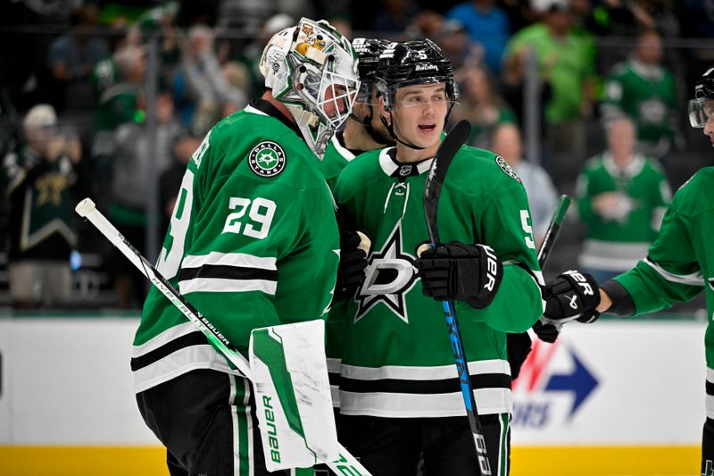 Oct 12, 2024; Dallas, Texas, USA; Dallas Stars goaltender Jake Oettinger (29) and defenseman Nils Lundkvist (5) celebrate on the ice after the Stars defeat the New York Islanders at the American Airlines Center. Mandatory Credit: Jerome Miron-Imagn Images