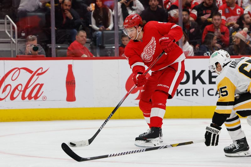 Oct 18, 2023; Detroit, Michigan, USA; Detroit Red Wings defenseman Moritz Seider (53) takes a shot in the second period against the Pittsburgh Penguins at Little Caesars Arena. Mandatory Credit: Rick Osentoski-USA TODAY Sports