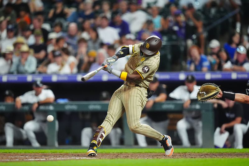 Aug 17, 2024; Denver, Colorado, USA; San Diego Padres outfielder Jurickson Profar (10) singles in the sixth inning against the Colorado Rockies at Coors Field. Mandatory Credit: Ron Chenoy-USA TODAY Sports