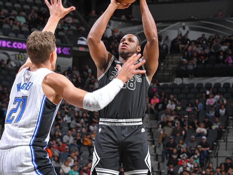 SAN ANTONIO, TX - MARCH 14: Charles Bassey #28 of the San Antonio Spurs shoots the ball during the game against the Orlando Magic on March 14, 2023 at the AT&T Center in San Antonio, Texas. NOTE TO USER: User expressly acknowledges and agrees that, by downloading and or using this photograph, user is consenting to the terms and conditions of the Getty Images License Agreement. Mandatory Copyright Notice: Copyright 2023 NBAE (Photos by Michael Gonzales/NBAE via Getty Images)