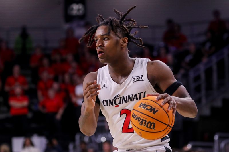 Dec 12, 2023; Cincinnati, Ohio, USA; Cincinnati Bearcats guard Jizzle James (2) dribbles against the Bryant Bulldogs in the second half at Fifth Third Arena. Mandatory Credit: Katie Stratman-USA TODAY Sports