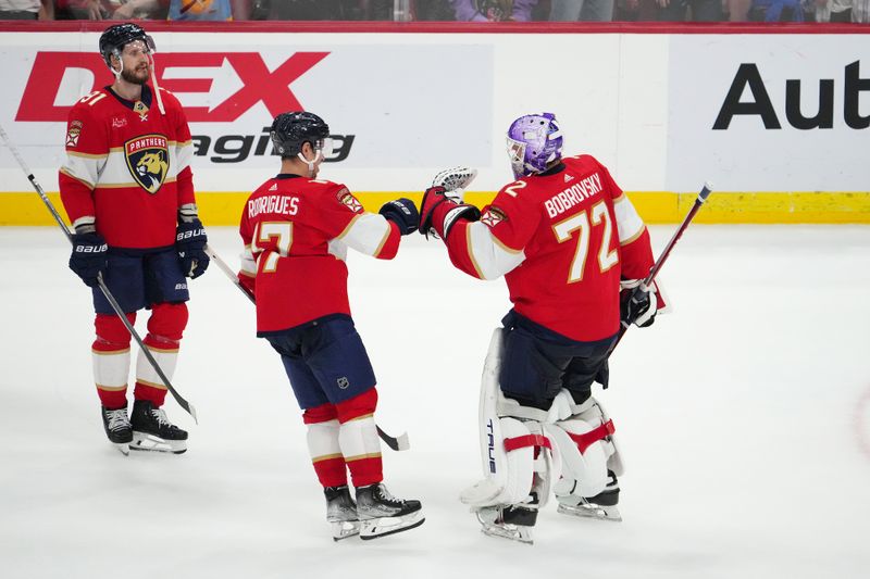 Nov 10, 2023; Sunrise, Florida, USA; Florida Panthers goaltender Sergei Bobrovsky (72) celebrates with center Evan Rodrigues (17) after defeating the Carolina Hurricanes at Amerant Bank Arena. Mandatory Credit: Jasen Vinlove-USA TODAY Sports