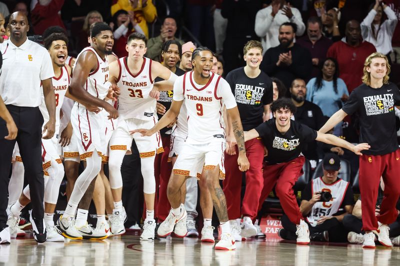 Feb 1, 2025; Los Angeles, California, USA;  USC Trojan players celebrate during a victory over the Michigan State Spartans at Galen Center. Mandatory Credit: William Navarro-Imagn Images