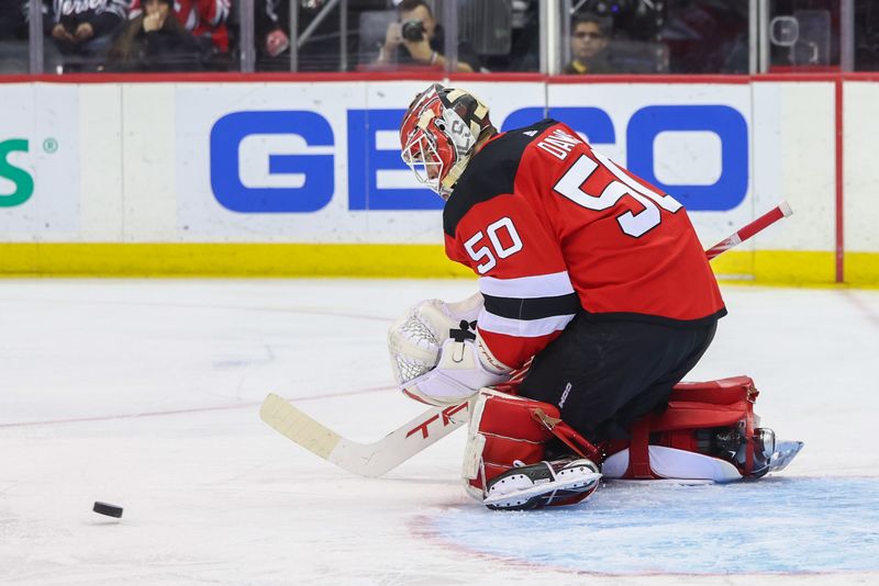 Jan 20, 2024; Newark, New Jersey, USA; New Jersey Devils goaltender Nico Daws (50) makes a save against the Dallas Stars during the first period at Prudential Center. Mandatory Credit: Ed Mulholland-USA TODAY Sports