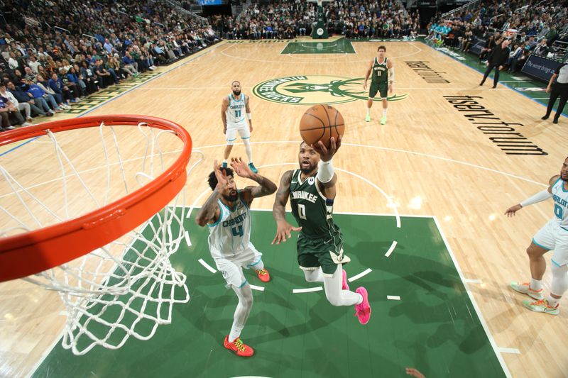 MILWAUKEE, WI - FEBRUARY 9: Damian Lillard #0 of the Milwaukee Bucks drives to the basket during the game against the Charlotte Hornets on February 9, 2024 at the Fiserv Forum Center in Milwaukee, Wisconsin. NOTE TO USER: User expressly acknowledges and agrees that, by downloading and or using this Photograph, user is consenting to the terms and conditions of the Getty Images License Agreement. Mandatory Copyright Notice: Copyright 2024 NBAE (Photo by Gary Dineen/NBAE via Getty Images).