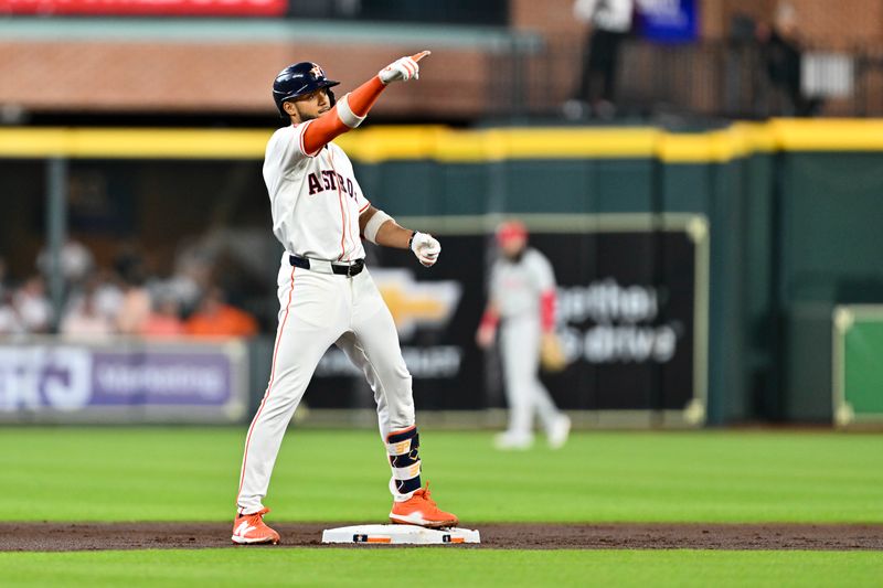Jun 25, 2025; Houston, Texas, USA; Houston Astros shortstop Jeremy Pena (3) reacts after hitting a double during the in the first inning against the Philadelphia Phillies at Daikin Park. Mandatory Credit: Maria Lysaker-Imagn Images 