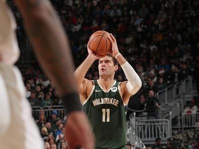 MILWAUKEE, WI - DECEMBER 11: Brook Lopez #11 of the Milwaukee Bucks shoots a three point basket during the game   on December 11, 2023 at the Fiserv Forum Center in Milwaukee, Wisconsin. NOTE TO USER: User expressly acknowledges and agrees that, by downloading and or using this Photograph, user is consenting to the terms and conditions of the Getty Images License Agreement. Mandatory Copyright Notice: Copyright 2023 NBAE (Photo by Gary Dineen/NBAE via Getty Images).