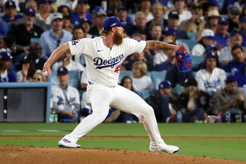 Oct 11, 2024; Los Angeles, California, USA; Los Angeles Dodgers pitcher Michael Kopech (45) pitches against the San Diego Padres in the eighth inning during game five of the NLDS for the 2024 MLB Playoffs at Dodger Stadium. Mandatory Credit: Kiyoshi Mio-Imagn Images