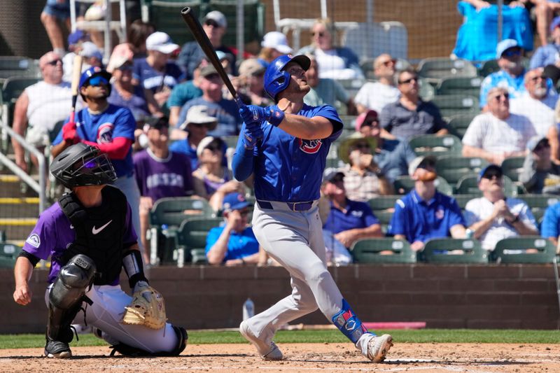 Mar 21, 2024; Salt River Pima-Maricopa, Arizona, USA; Chicago Cubs third baseman Michael Busch (29) hits against the Colorado Rockies in the fourth inning at Salt River Fields at Talking Stick. Mandatory Credit: Rick Scuteri-USA TODAY Sports