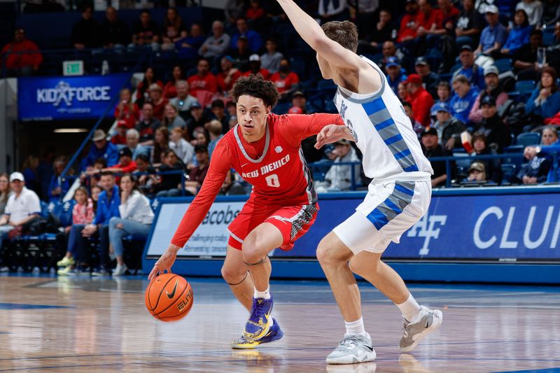 Feb 10, 2023; Colorado Springs, Colorado, USA; New Mexico Lobos guard KJ Jenkins (0) drives to the net against Air Force Falcons guard Camden Vander Zwaag (30) in the first half at Clune Arena. Mandatory Credit: Isaiah J. Downing-USA TODAY Sports