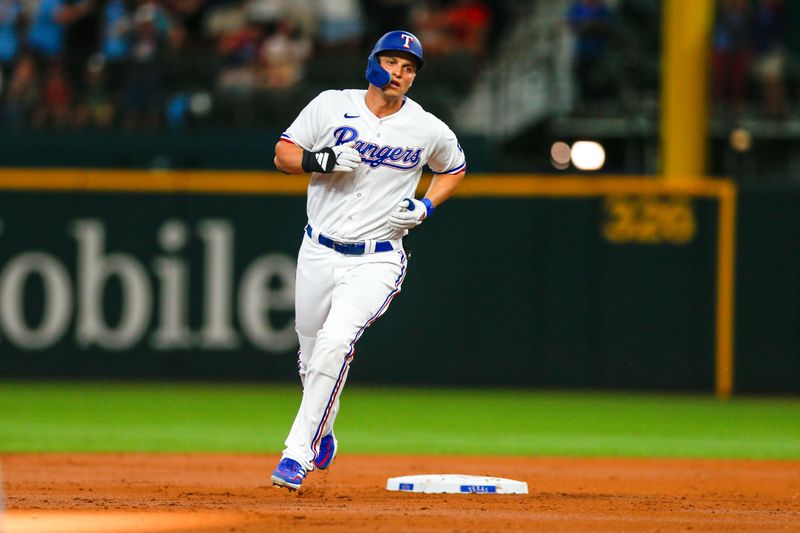 Aug 2, 2023; Arlington, Texas, USA; Texas Rangers Shortstop Cory Seager (5) hits a two-run home run during the first inning against the Chicago White Sox at Globe Life Field. Mandatory Credit: Andrew Dieb-USA TODAY Sports