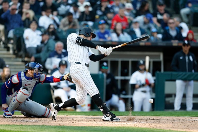 May 24, 2025; Chicago, Illinois, USA; Chicago White Sox right fielder Mike Tauchman (18) reaches on the fielders choice against the Texas Rangers during the sixth inning at Rate Field. Mandatory Credit: Kamil Krzaczynski-Imagn Images