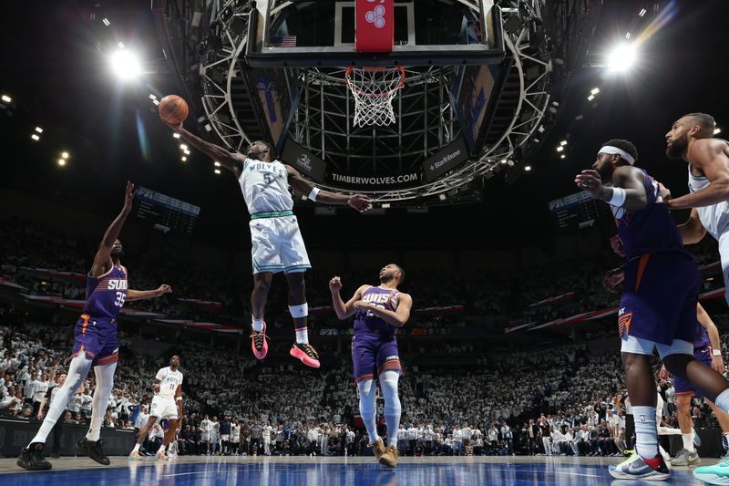 MINNEAPOLIS, MN -  APRIL 20: Anthony Edwards #5 of the Minnesota Timberwolves grabs a rebound during the game against the Phoenix Suns during Round 1 Game 1 of the 2024 NBA Playoffs on April 20, 2024 at Target Center in Minneapolis, Minnesota. NOTE TO USER: User expressly acknowledges and agrees that, by downloading and or using this Photograph, user is consenting to the terms and conditions of the Getty Images License Agreement. Mandatory Copyright Notice: Copyright 2024 NBAE (Photo by David Sherman/NBAE via Getty Images)