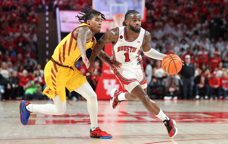 Feb 19, 2024; Houston, Texas, USA; Houston Cougars guard Jamal Shead (1) drives with the ball as Iowa State Cyclones guard Keshon Gilbert (10) defends during the second half at Fertitta Center. Mandatory Credit: Troy Taormina-USA TODAY Sports