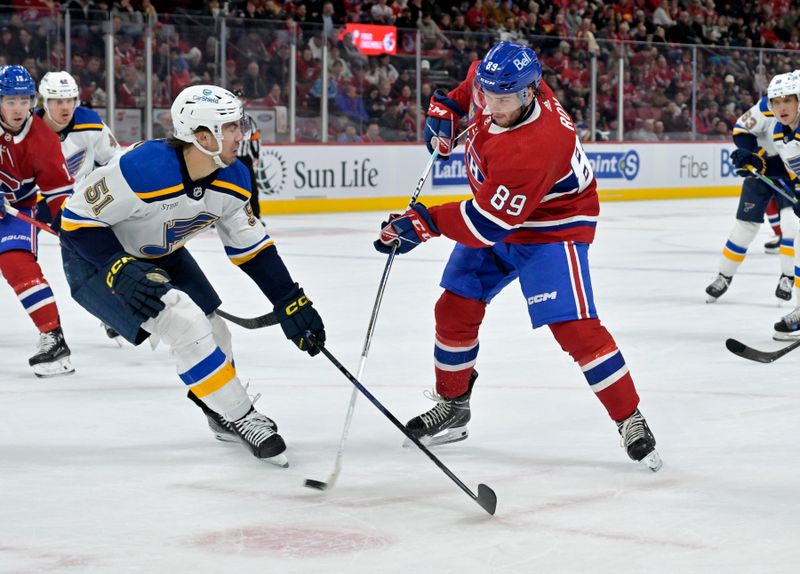 Feb 11, 2024; Montreal, Quebec, CAN; Montreal Canadiens forward Joshua Roy (89) takes a shot on net and St.Louis Blues defenseman Matthew Kessel (51) defends during the second period at the Bell Centre. Mandatory Credit: Eric Bolte-USA TODAY Sports